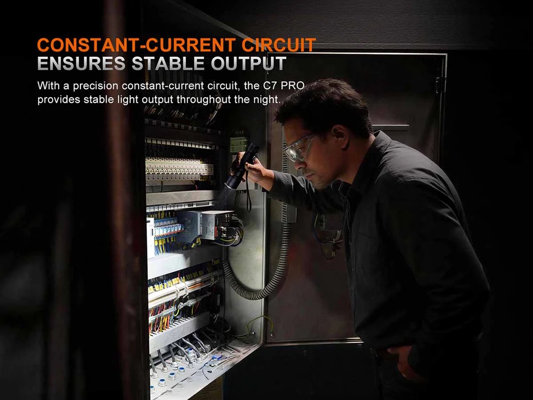 Tech in safety glasses inspecting an electrical control cabinet with exposed wiring; overlay reads 'Constant-Current Circuit Ensures Stable Output'.