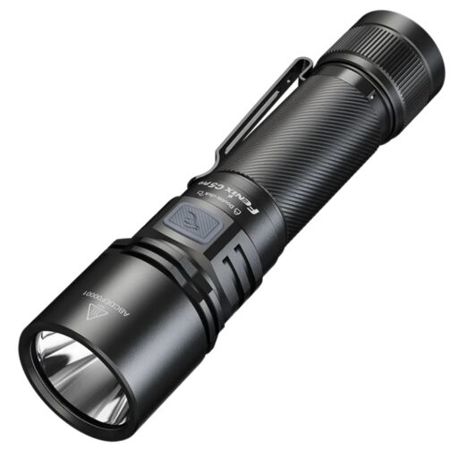 Bright tactical flashlight with knurled grip, side switch, and pocket clip viewed at an angle under bright lighting.