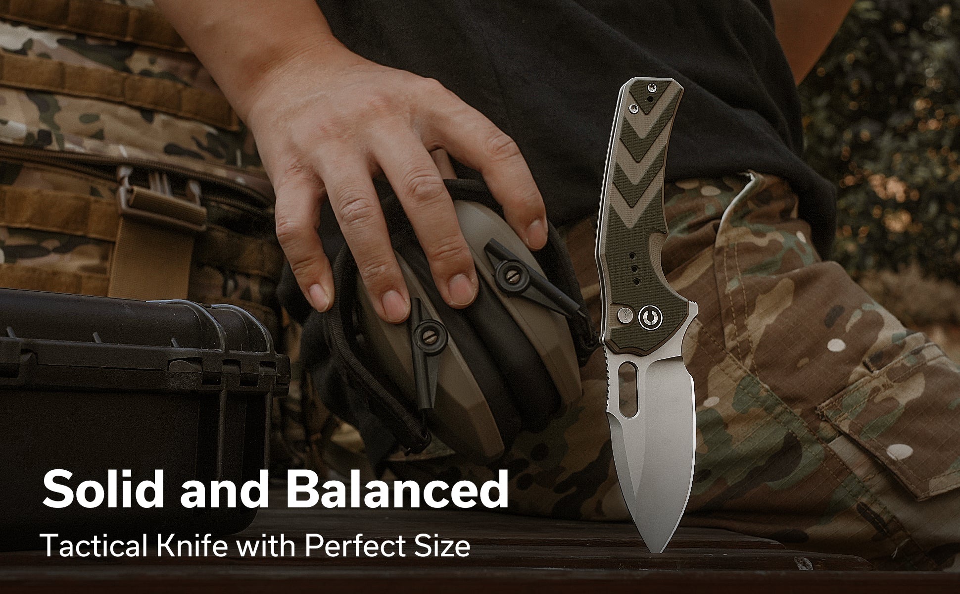 Tactical knife with a textured green chevron-pattern handle held near camouflage gear; part of a product shot showing durability and design features