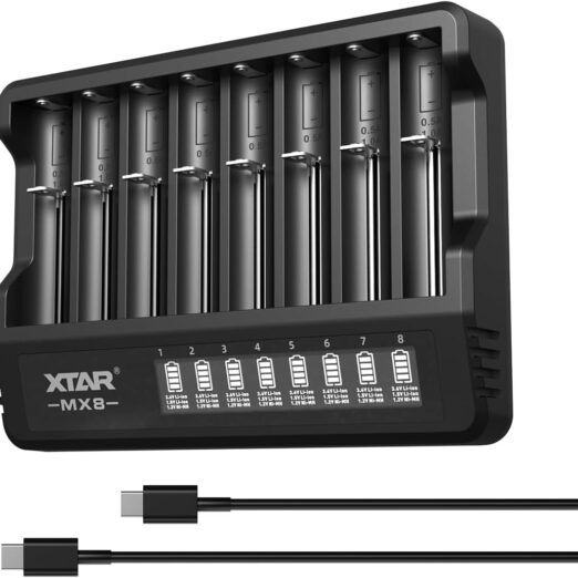 Eight-bay XTAR MX8 battery charger with eight batteries loaded and charging indicators visible on each slot.