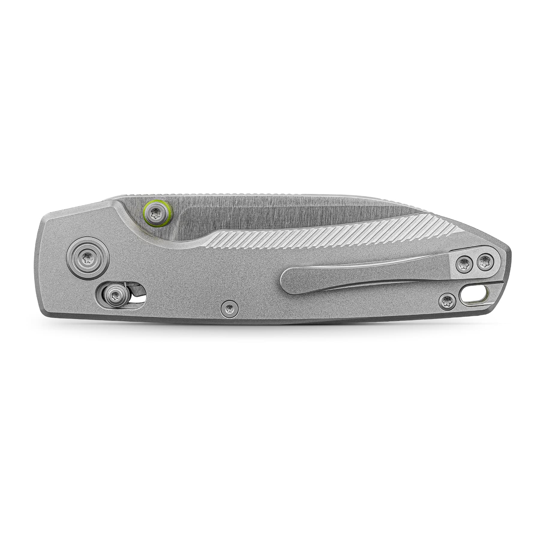 Close-up of a gray folding knife handle with textured grip and exposed screws, including a lime-green ring around one screw.