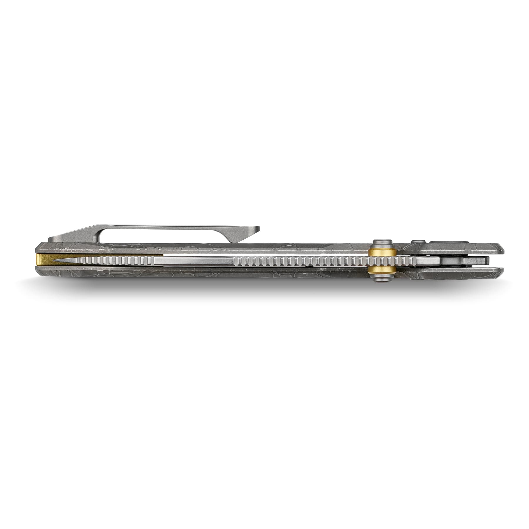 Close-up of a closed, textured gray folding knife with a gold-colored pivot/screw detail on the handle cap, lying flat.