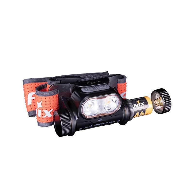 Headlamp with two LED lights, black body, orange adjustable strap with FOX branding and a battery pack attached to the side.