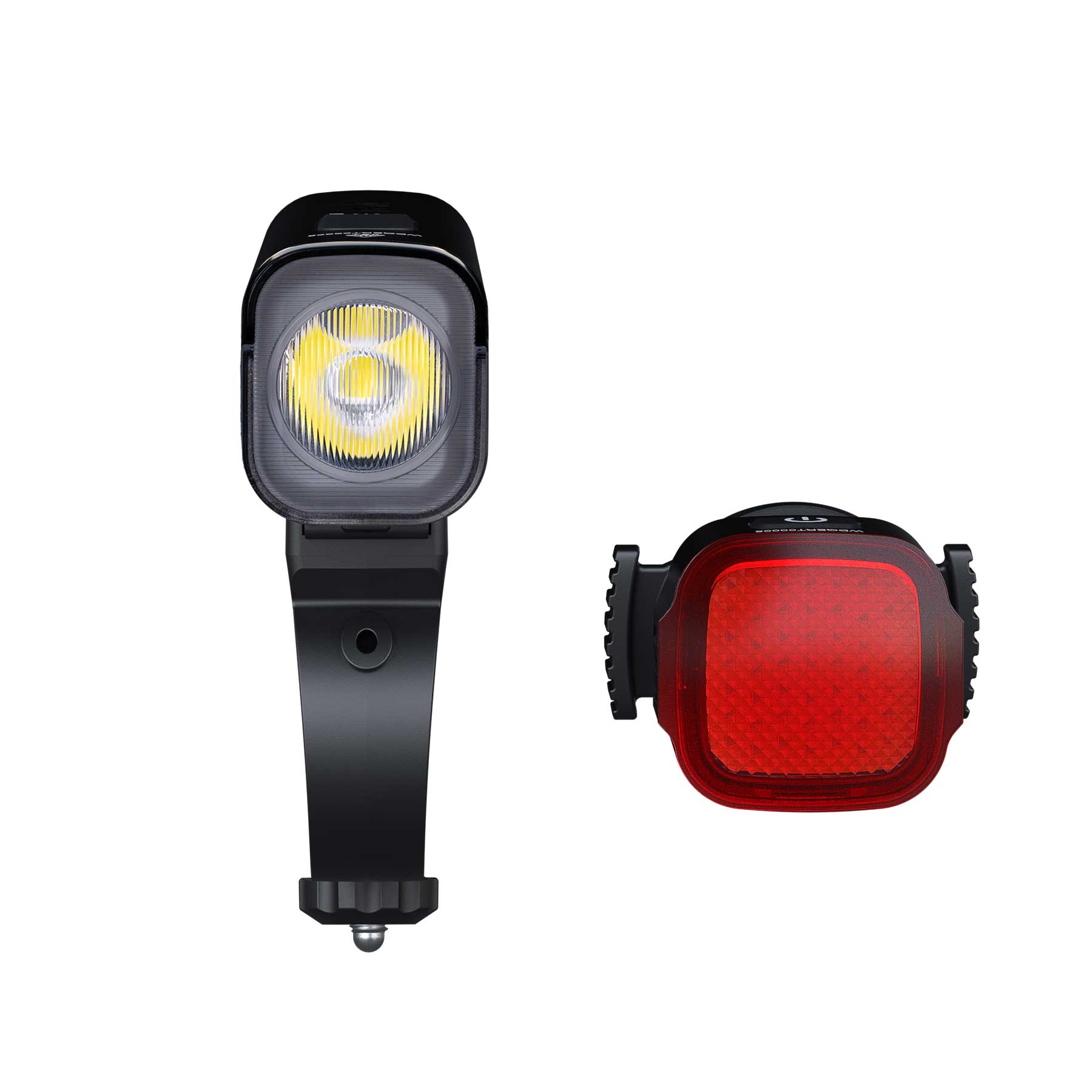 Two bike lights: a square black front/spotlight with a yellow LED array on the left and a red taillight with a textured lens on the right.