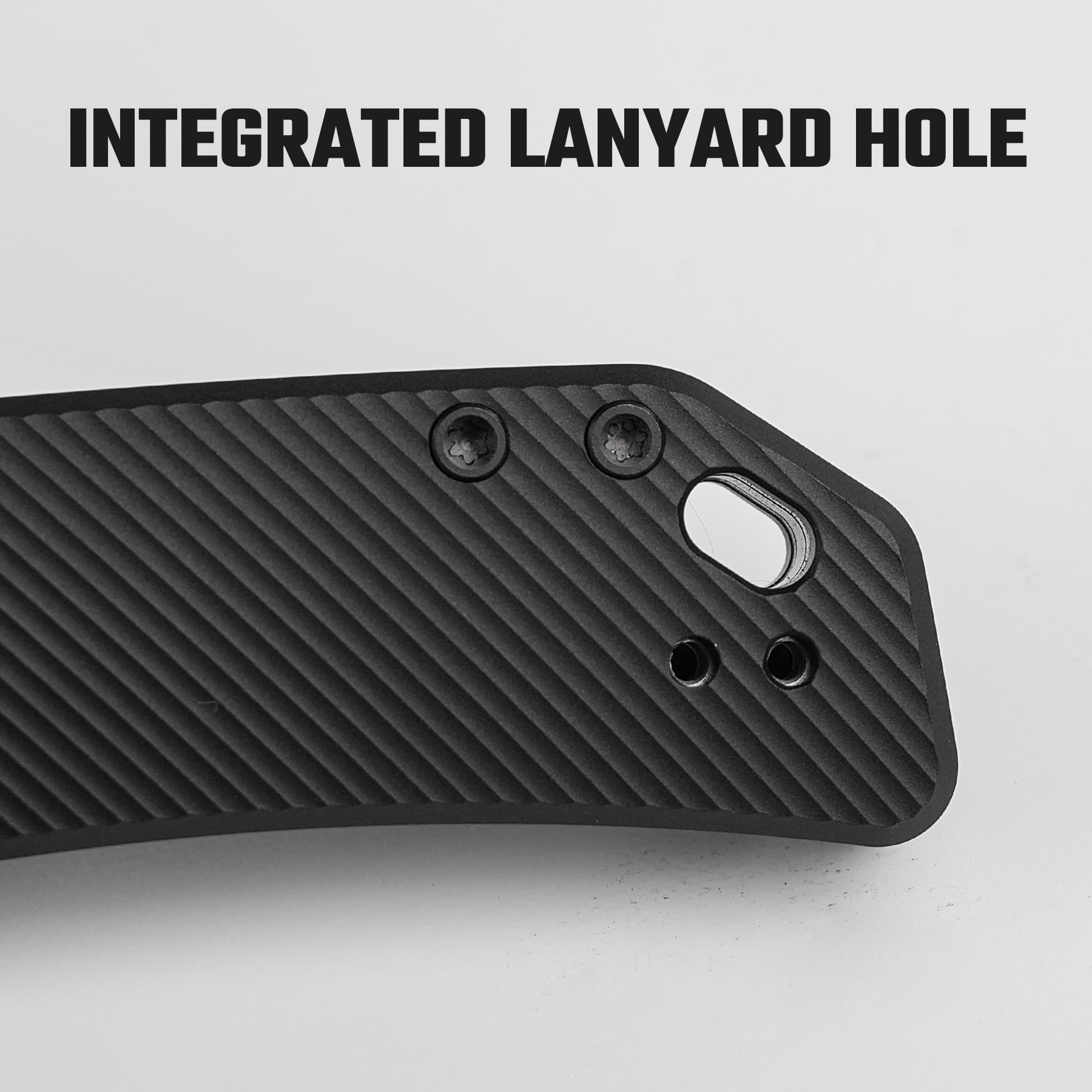 Close-up of a black ribbed plastic surface with an integrated oval lanyard hole and two nearby screw holes.