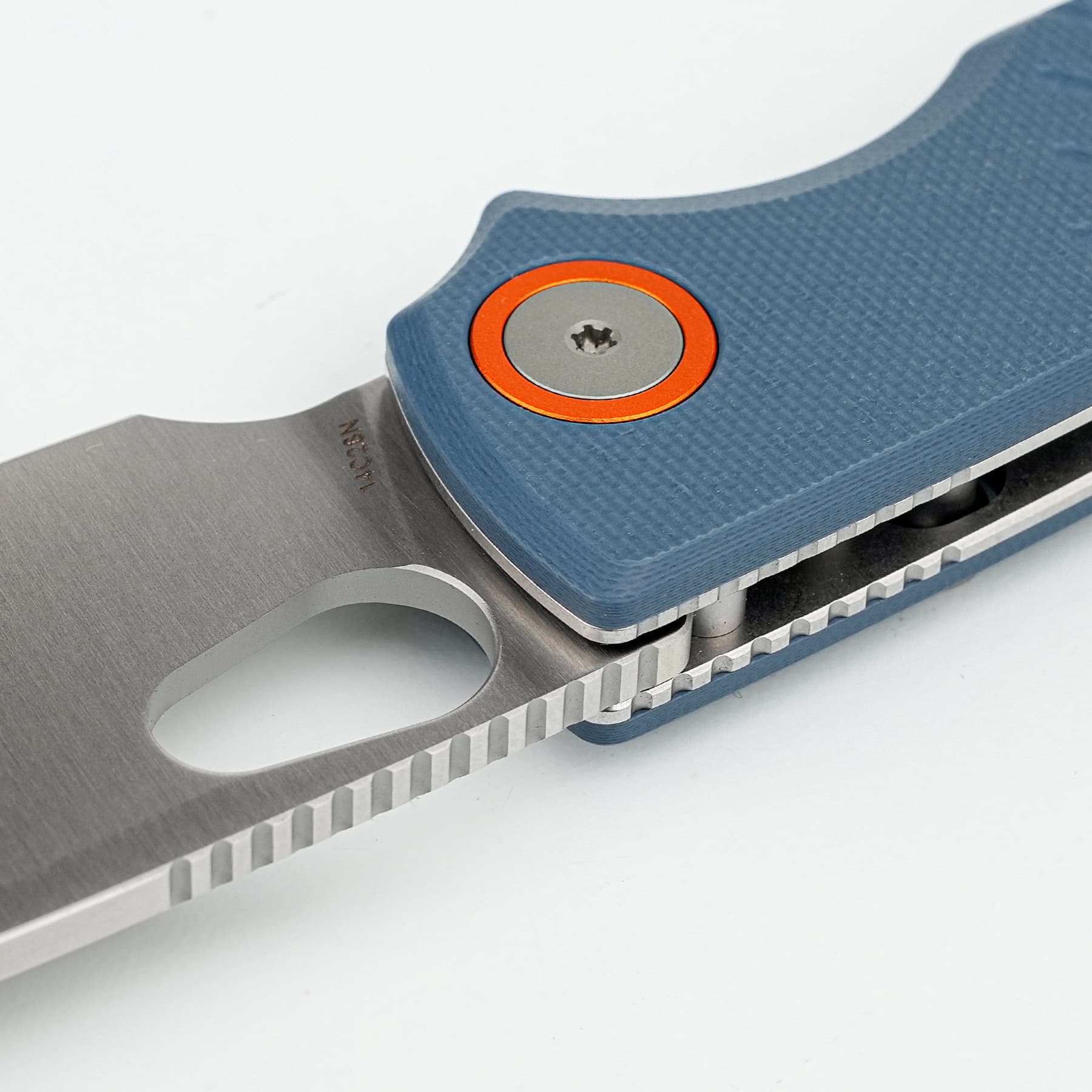 Close-up of a blue textured folding knife with a partially extended silver blade and an orange circular pivot ring.