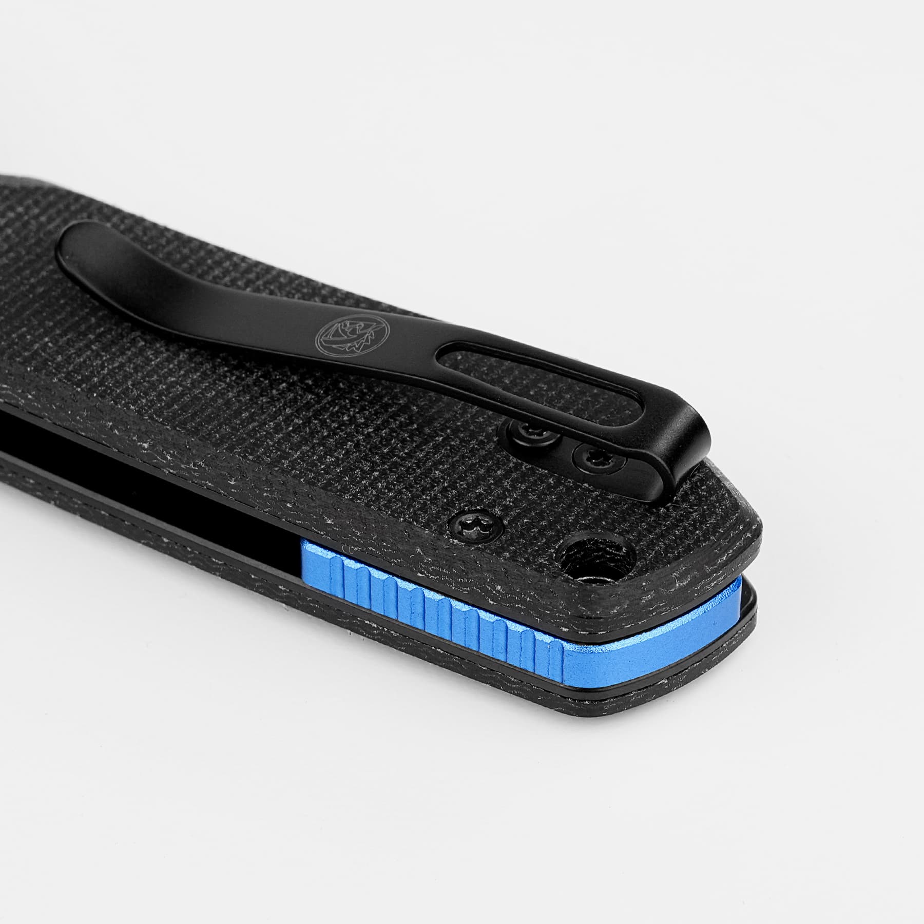 Close-up of a black textured clamp with a blue ridged edge and two screws on a white background.