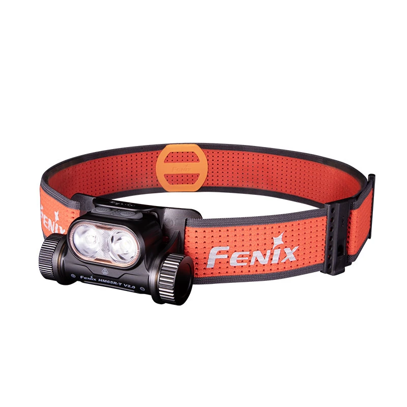 Orange headlamp with dual LEDs and a perforated strap branded ‘Fenix’ for hands-free lighting.