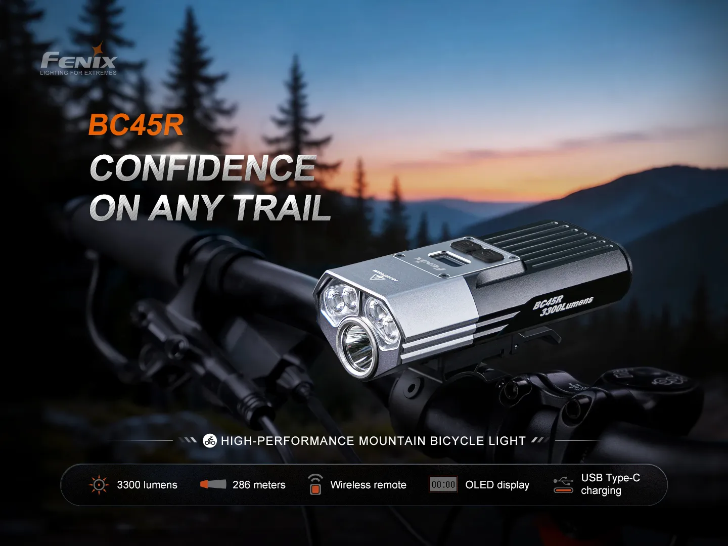 Fenix BC45R mountain bike light mounted on handlebars with a sunset mountain background.