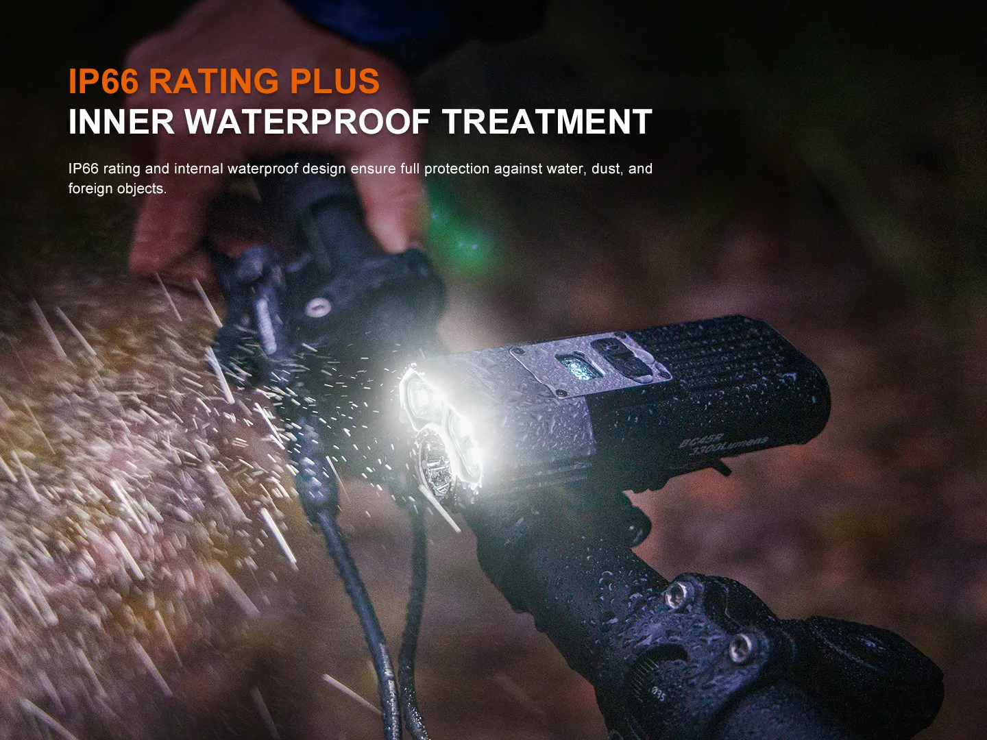Close-up of a rugged bike light mounted on a handlebar, emitting light in the dark with water droplets visible, highlighting its waterproof design (IP66).