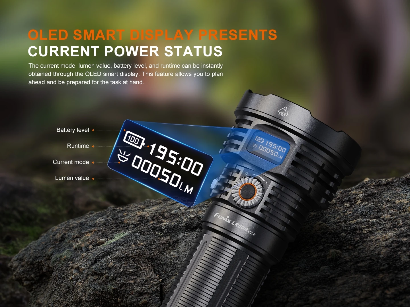 Flashlight with an OLED display showing battery level, runtime, current mode, and lumen value on a rocky surface in a forested setting.